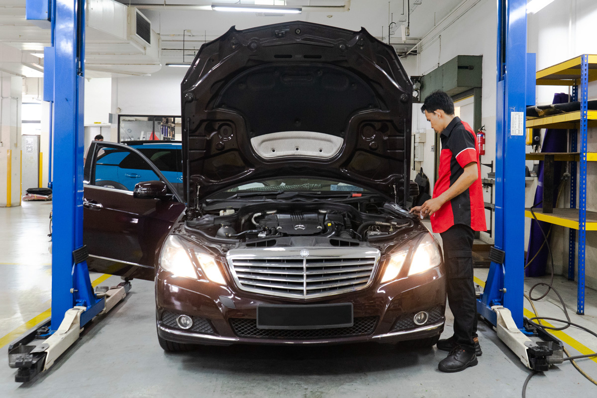 Car being inspected by a mechanic